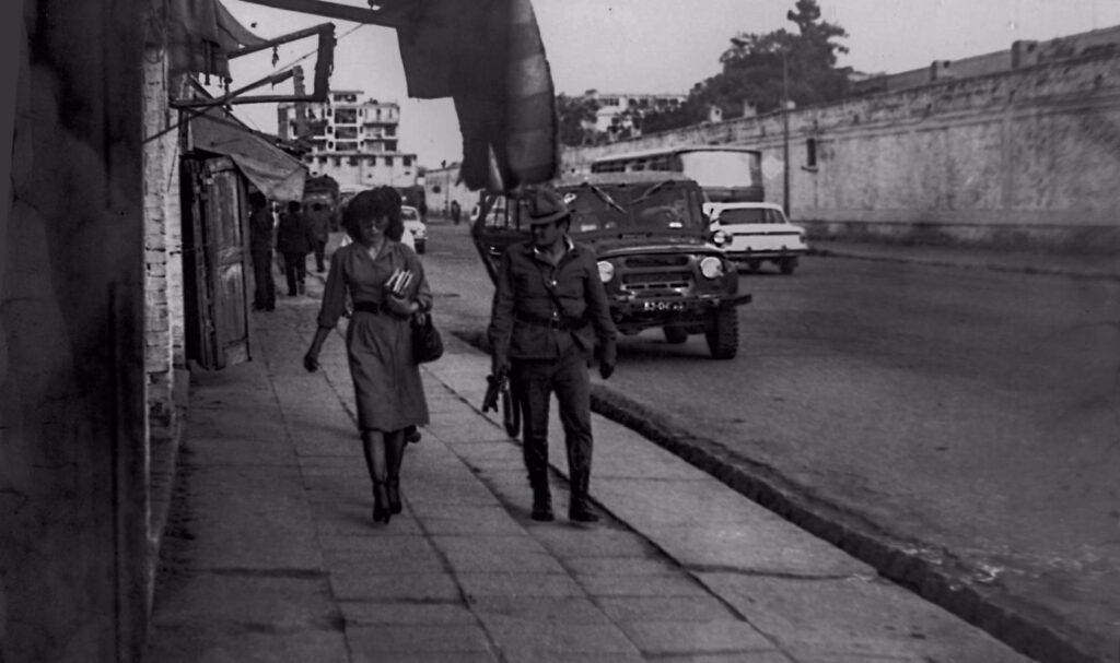 Soviet soldier with a gun patrolling the streets of Kabul