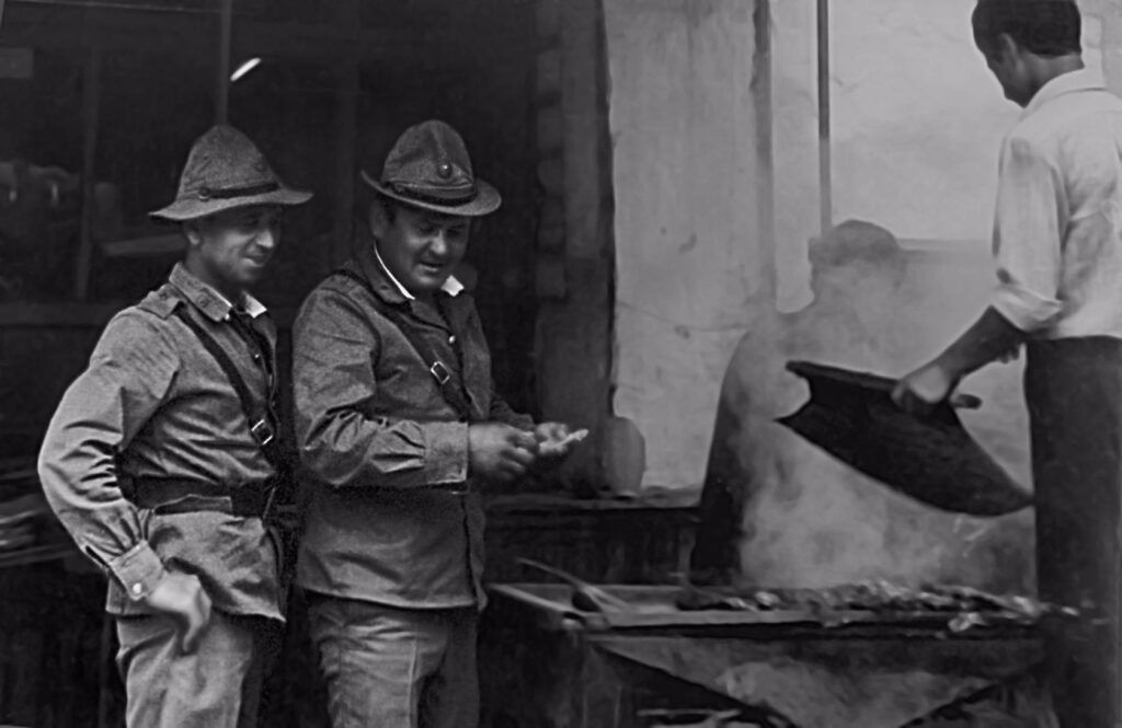 Soviet soldiers next to a Chef making Kebab in a Restaurant.